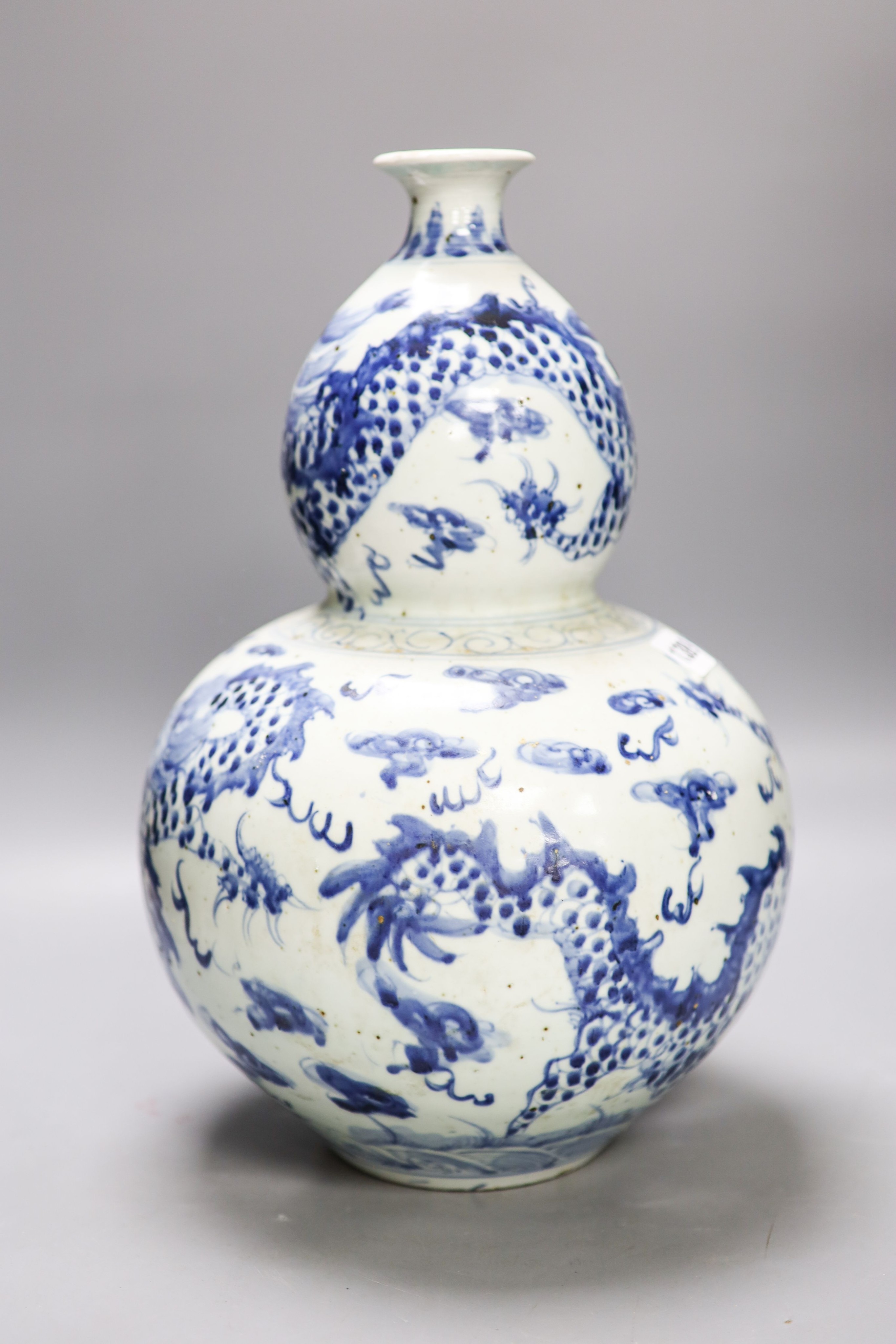 An impressive Chinese blue and white double gourd ‘dragon’ vase 37cm